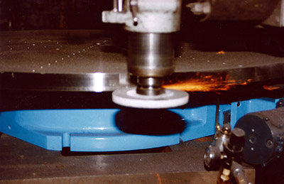 A rotary grinding table performing outside diameter milling work on a CNC machine